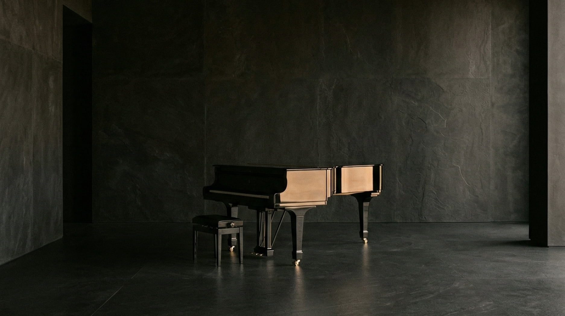 Pièce sombre avec piano noir dans une ambiance masculine élégante et minimaliste